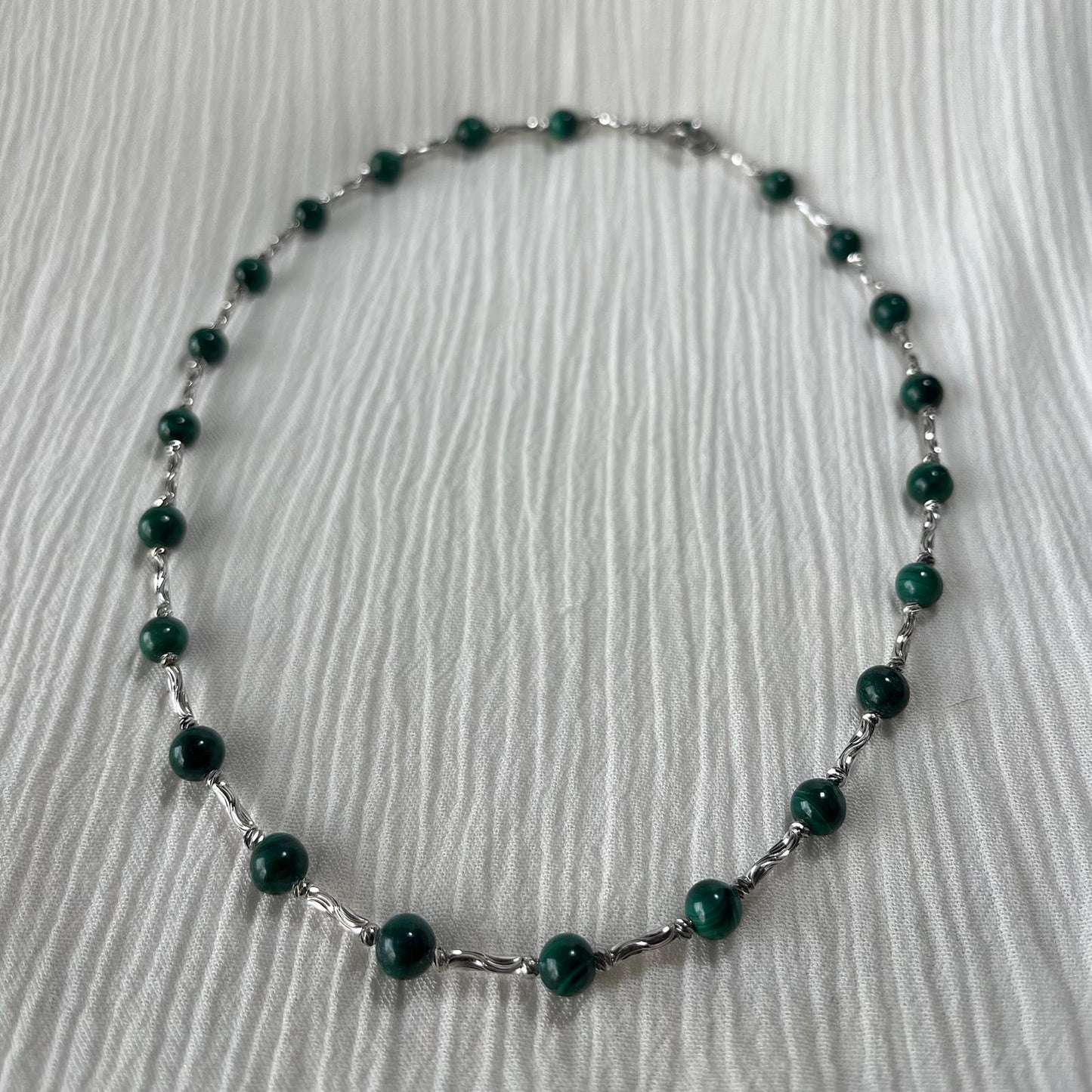 Conjunto de malaquita en titanio