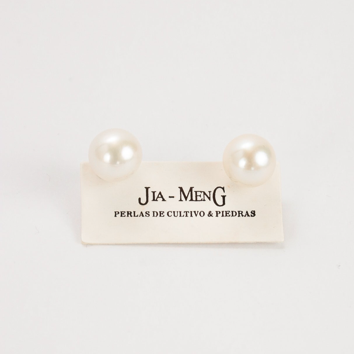 Caravanas de perla redonda con base de plata 925