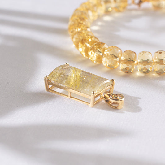 Colgante en cuarzo rutilado y Oro 18 K